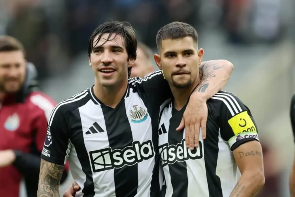 Sandro Tonali puts his arm around Bruno Guimaraes